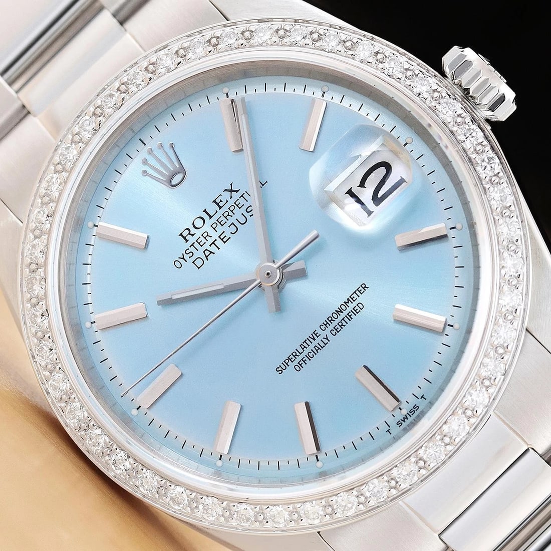 ROLEX DATEJUST 1601 18K GOLD STEEL ICE BLUE DIAMOND WATCH w/ OYSTER BRACELET: This is an authentic Rolex Datejust 1601 watch with Rolex stick dial Ref., custom 18K white gold diamond bezel, and custom stainless steel oyster bracelet. Descriptions: Brand:RolexModel:DatejustRefer