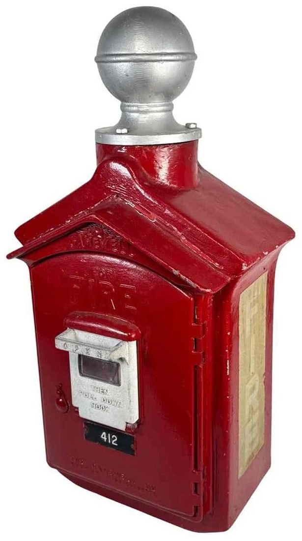 Antique GAMEWELL Cast Iron Pedestal Fire Call Box Pull Station Cannonball Finial: an antique fire alarm box manufactured by The Gamewell Company in Newton, Massachusetts. The Gamewell Company has a rich history in fire safety and innovation. Founded in 1879, The Gamewell Company