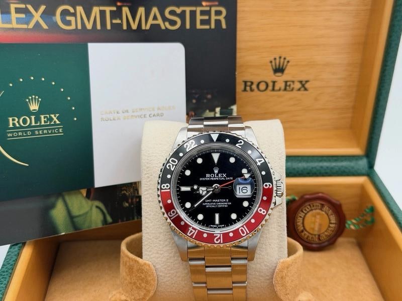 Rolex GMT Master II Coke 16710 40mm Red Black Bezel Steel Box Service Card: Style Number: 16710 Serial: A46**** Year: 1999 Model: Rolex GMT Master II 'Coke' Case Material: Stainless Steel Band: Stainless Steel Bezel: Coke - Red & Black Dial: Black Crystal: Sapphire Case Size: