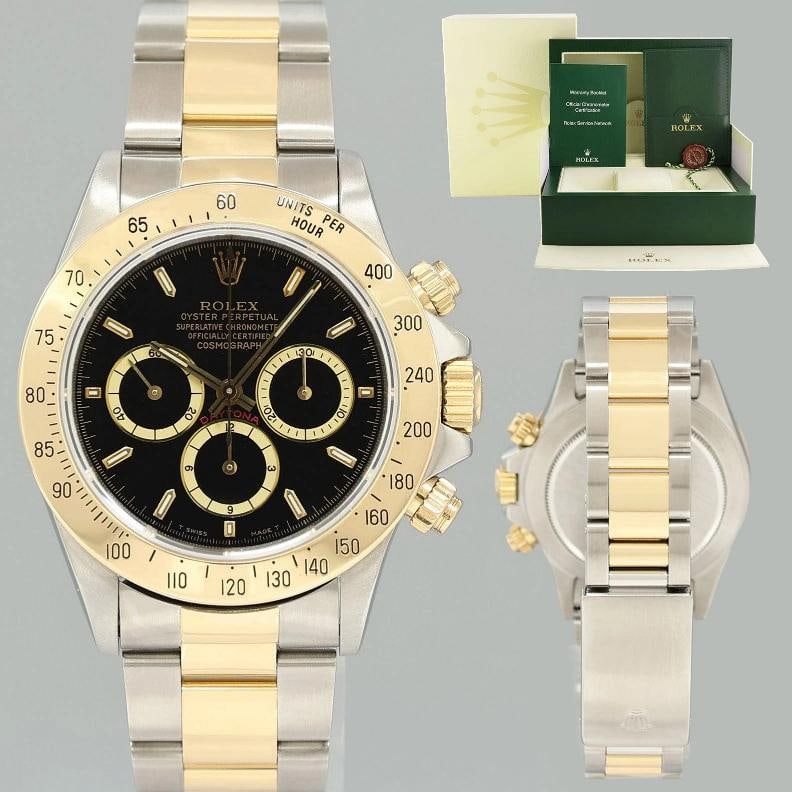 MINT Rolex Daytona 16523 Zenith Black Chrono Yellow Gold Two Tone Watch Box: Brand Rolex (Guaranteed Authentic) Model Daytona Cosmograph 'Zenith' Reference Number 16523 Serial Number E Gender Men's Metal Yellow Gold / Steel Case Size 40.00mm Wrist Size This watch will