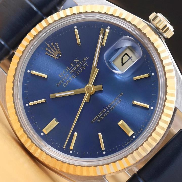 ROLEX MENS DATEJUST 16013 18K GOLD STEEL BLUE DIAL WATCH w/ BLUE LEATHER BAND: This is an authentic Rolex Datejust 16013 watch with Rolex stick dial Ref., Rolex 18K yellow gold fluted bezel, and custom genuine blue leather strap. Descriptions: Brand: Rolex Model: Datejust