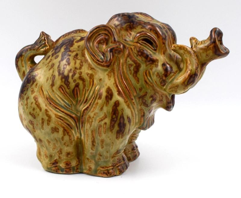 Royal Copenhagen Knud Kyhn Stoneware Art Deco Large Elephant, Signed: The Royal Copenhagen Knud Kyhn Stoneware Art Deco Large Elephant figurine is a stunning piece of decorative pottery that showcases the brand's reputation for quality craftsmanship. Made of durable