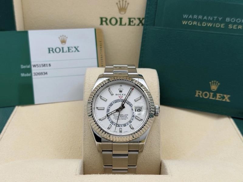 Rolex Sky Dweller 326934 42mm White Dial 18k Gold Stainless Steel Box Paper: Style Number: 326934 Serial: W515**** Year: 2019 Model: Rolex Sky Dweller Case Material: Stainless Steel Band: Stainless Steel Bezel: 18k White Gold Fluted Dial: White