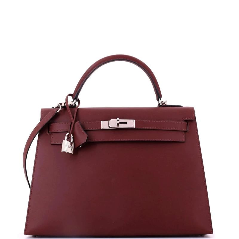 Hermes Kelly Handbag Red Sombrero with Palladium Hardware 32: Condition: Pre-owned - Excellent,Brand: Hermes,Exterior Material: Leather,Style: Top Handle,Exterior Color: Red,Department: Women,Size: 32,Accessories: Keys, Clochette, Lock, With Strap 