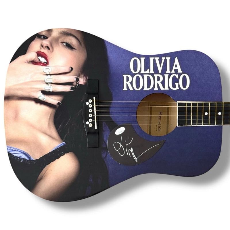 OLIVIA RODRIGO Signed Guitar JSA COA Custom GUTS SOUR VAMPIRE: Industry: Music,Signed: Yes,Autograph Authentication: James Spence (JSA),Object Type: Guitar & Guitar Pick,Original/Reproduction: Original,Country of Origin: United States This full-size Huntington ac