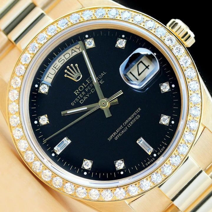ROLEX DAY-DATE 18038 BLACK FACTORY DIAMOND 18K GOLD PRESIDENT 1.6 CT BEZEL WATCH: This is an authentic Rolex Day-Date 18238 watch with 18K yellow gold president bracelet, factory Rolex diamond dial Ref., custom 18K yellow gold 1.60 CT diamond bezel, and factory Rolex box.