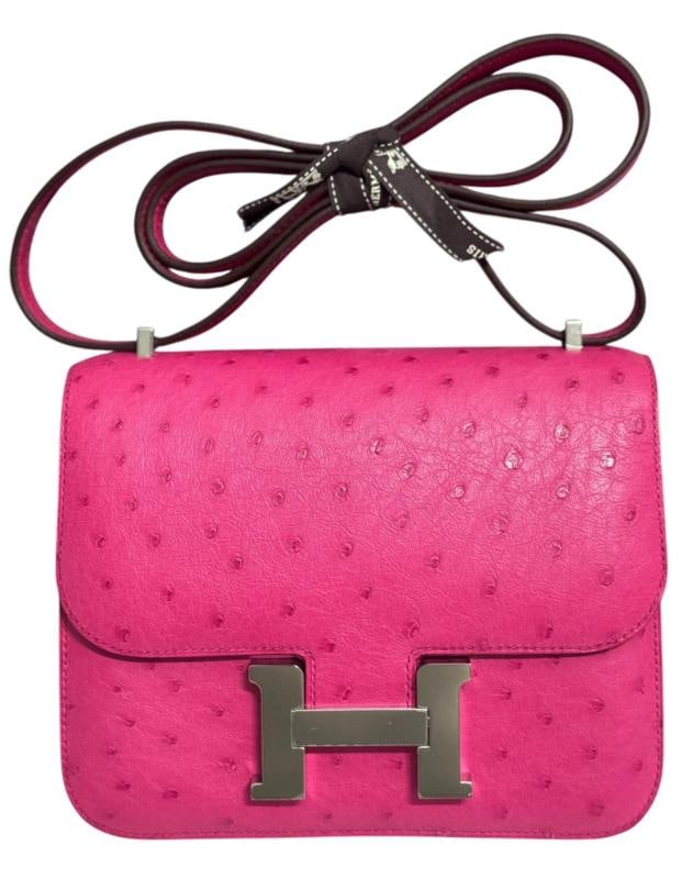 HERMES Constance 18 Mini Rose Tyrien Pink Ostrich Leather Palladium Hardware: Measurements: 5" Height . 7" Width 3.5" Depth. Condition: New without tags,Country of Origin: France,Bag Width: 7 in,Closure: Buckle,Handle/Strap Color: Pink,Size: Mini,Hardware Color: Silver,Bag