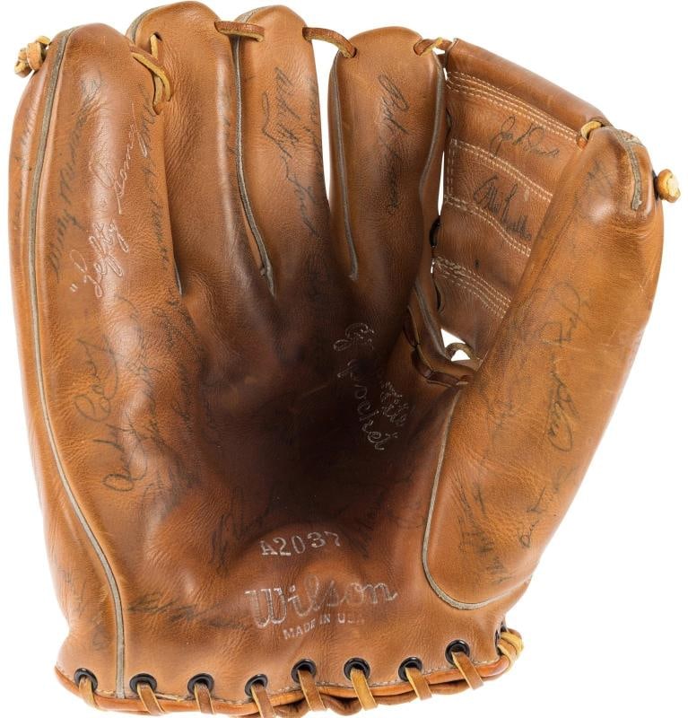1954 New York Yankees Team Signed Baseball Glove 55 Sigs Mickey Mantle PSA DNA: Signatures include: Mickey Mantle, Casey Stengel, Phil Rizzuto, Bill Dickey, Eddie Robinson, Whitey Ford, Gene Woodling, Johnny Sain, Ed Lopat, Gil McDougald, Irv Noren, Yogi Berra, Dizzy Trout,