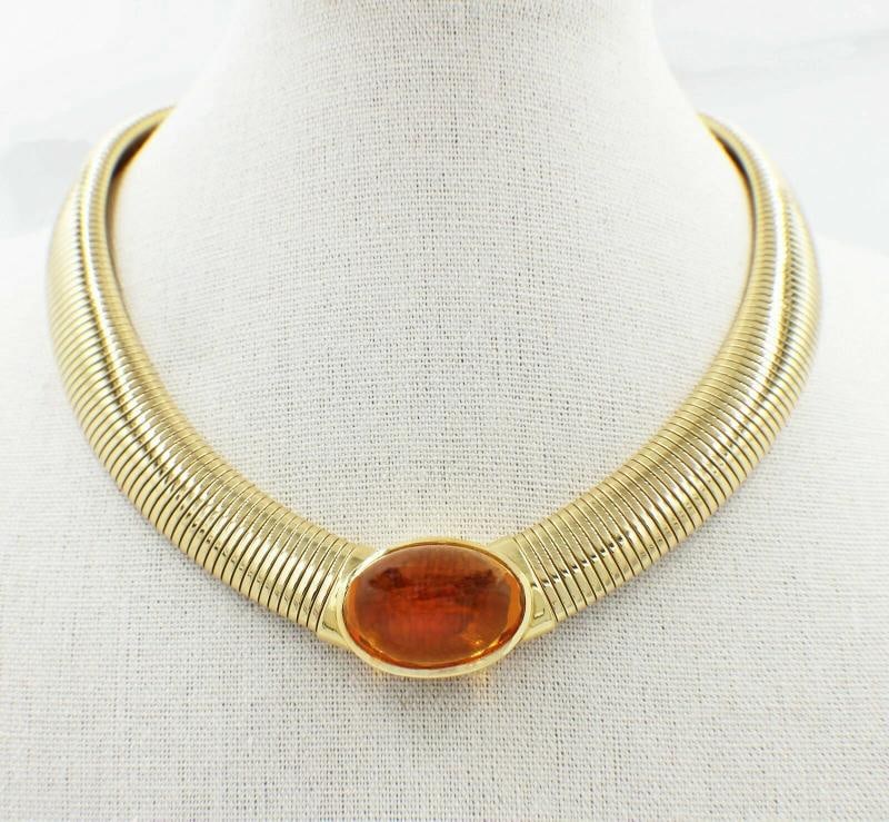 Vintage Cartier Amber Cabochon Collar Necklace 18k Yellow Gold: Cartier Vintage Signed Jewelry Style: Tubugas Yellow Gold Collar Necklace with Amber Cabochon Serial Number: 745623 Metal: 18k Yellow Gold Size: 14 Inches Dimensions: 14 - 15 MM in width / 3 MM