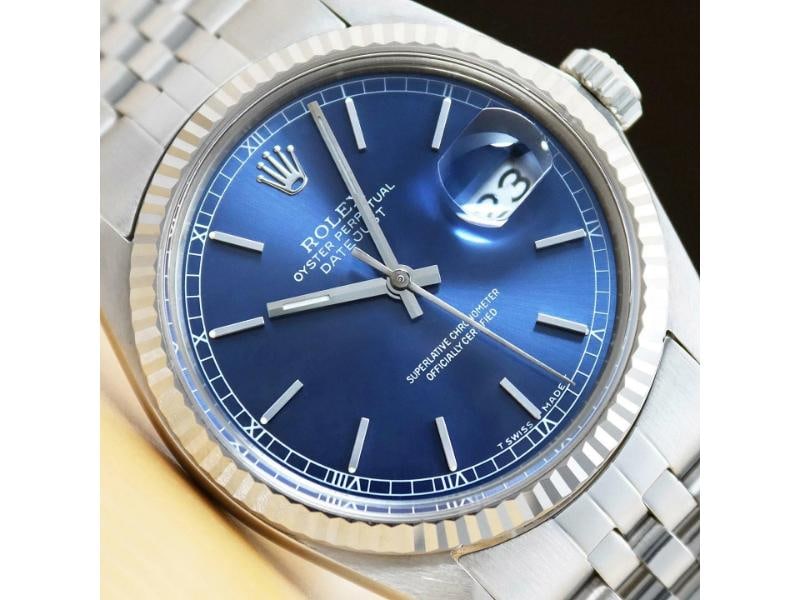 ROLEX MENS DATEJUST 16014 BLUE DIAL 18K WHITE GOLD STAINLESS STEEL WATCH: Condition: Pre-owned - Good,Bezel Color: Silver,Max Wrist Size: 7.26-7.5 in,Number of Jewels: 27 Jewels,Indices: Stick Indexes, 12-Hour Dial,Bezel: Rolex 18K White Gold Fluted Bezel,Band/Strap: