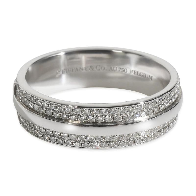Tiffany & Co. White Gold Diamond Tiffany T Wide Ring: Condition: Pre-owned - Good,Shape: Round Brilliant,Country of Origin: Belgium,Side Stone Type: Diamond,Side Stone Weight (cts): 0.57,Metal Purity: 18k,With Original Box/Packaging: No,With Papers: No,G