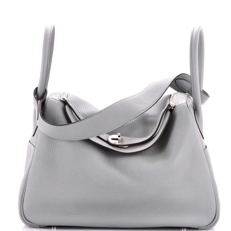 Hermes Lindy Bag Clemence 34: Condition: Pre-owned - Excellent,Brand: Hermes,Exterior Material: Leather,Style: Satchels,Exterior Color: Blue,Department: Women,Size: 34,Accessories: Dust Bag Estimated Retail Price: $8,700