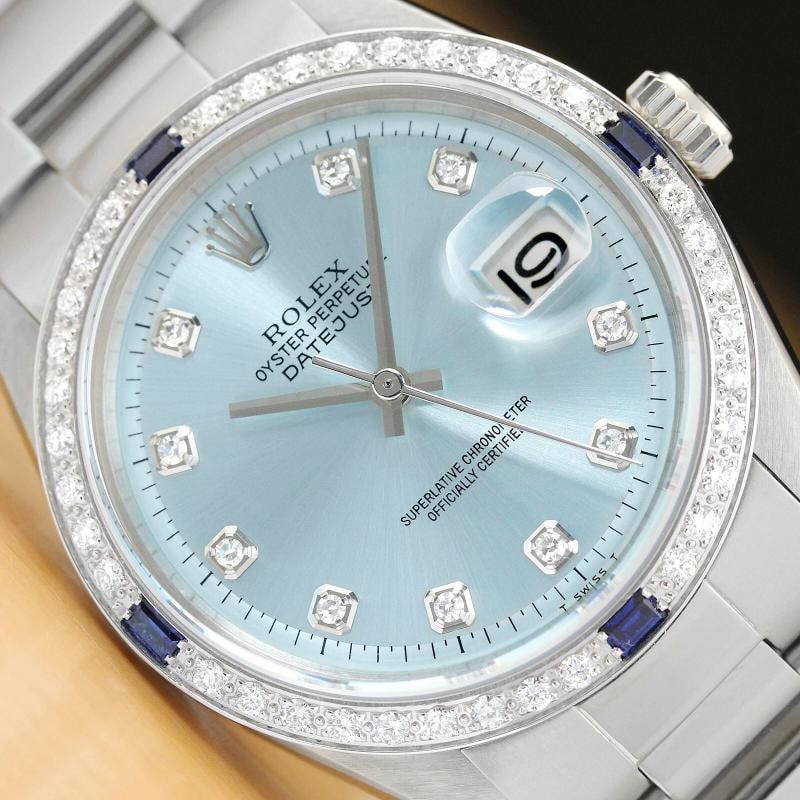 MENS ROLEX DATEJUST ICE BLUE 18K WHITE GOLD DIAMOND SAPPHIRE & STEEL WATCH: This is an authentic Rolex Datejust 1603 watch with Rolex dial Ref. with added diamond hour markers, custom 18K white gold sapphire diamond bezel, and custom stainless steel oyster bracelet.Descriptio