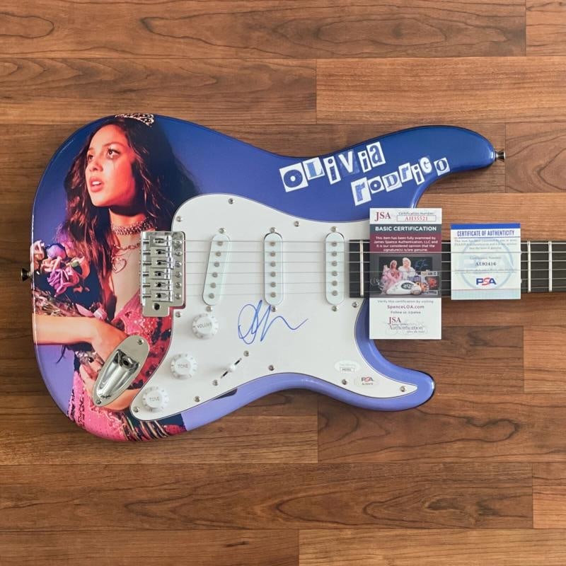 OLIVIA RODRIGO Signed Custom Guitar (JSA + PSA COA): Industry: Music,Signed: Yes,Autograph Authentication: James Spence (JSA),Object Type: Guitar & Guitar Pick,Original/Reproduction: Original,Country of Origin: United States