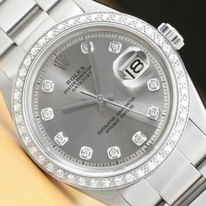 ROLEX DATEJUST MENS 18K WHITE GOLD DIAMOND STAINLESS STEEL GRAY DIAL WATCH: This is an authentic Rolex Datejust 1603 watch with Rolex dial Ref. with added diamond hour markers, custom 18K white gold diamond bezel, and custom stainless steel oyster bracelet. Descriptions: Bran