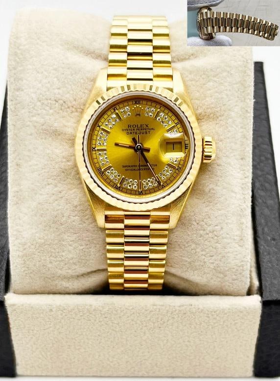 Rolex Ladies President Datejust 69178 Diamond String Dial 18K Yellow Gold: Condition: Pre-owned - Excellent,Bezel Color: Gold, Yellow,Dial Pattern: Diamond Pattern,Indices: Stick Indexes,Year Manufactured: 1990-1999,Band/Strap: Rolex President,Case Color: Gold,