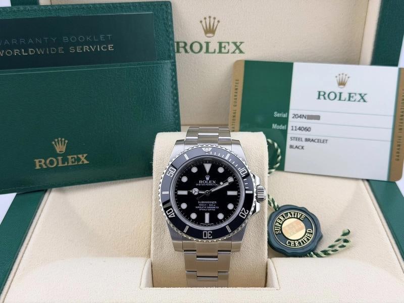 Rolex Submariner No Date 114060 40mm Black Ceramic Stainless Steel Box Paper: Condition: Pre-owned - Excellent,Bezel Color: Black,Movement: Mechanical (Automatic),,Year Manufactured: 2010-2019,With Papers: Yes,Band/Strap: Rolex Oyster,Reference Number: 114060,Brand: Rolex,Case