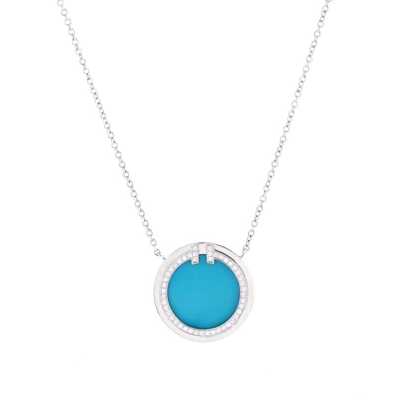 Tiffany Co T Circle Pendant Necklace 18K White Gold with Turquoise: Measurements Length 16 18 Pendant Width 16 mm Condition Preowned GoodBrand Tiffany CoMain Stone UnknownMetal 18K White GoldMetal Purity 18KStyle PendantType NecklaceColor White GoldMaterial 18K White