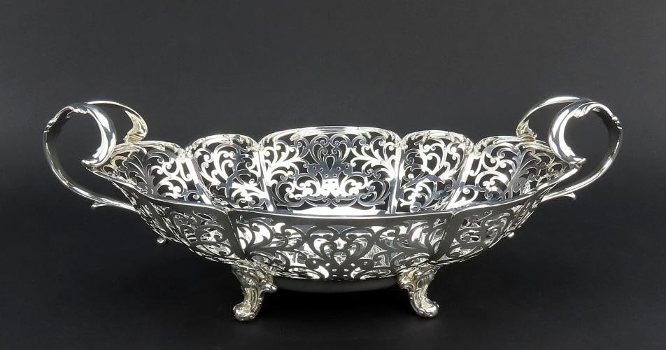 Fancy Large Pierced Handled Oval Bowl w Claw Feet Scroll Decorations 15 Long: Measurements 15 inches across from handle to handle 8 34 inches wide and 5 12 inches tall Weight 711 grams or 25 ounces Brand Bailey Banks BiddleAge 18801920Composition Sterling SilverCountry of