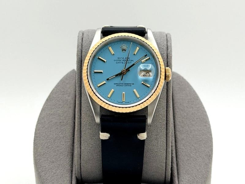 Rolex Datejust 16233 36mm Aqua Blue Dial 18k Yellow Gold Stainless Steel: Style Number 16233 Serial W41 Year 1995 Model Rolex Datejust Case Material Stainless Steel Band Custom Black Leather Band with Custom Steel Buckle Bezel 18k Yellow Gold Fluted Dial Custom Aqua Blue Di