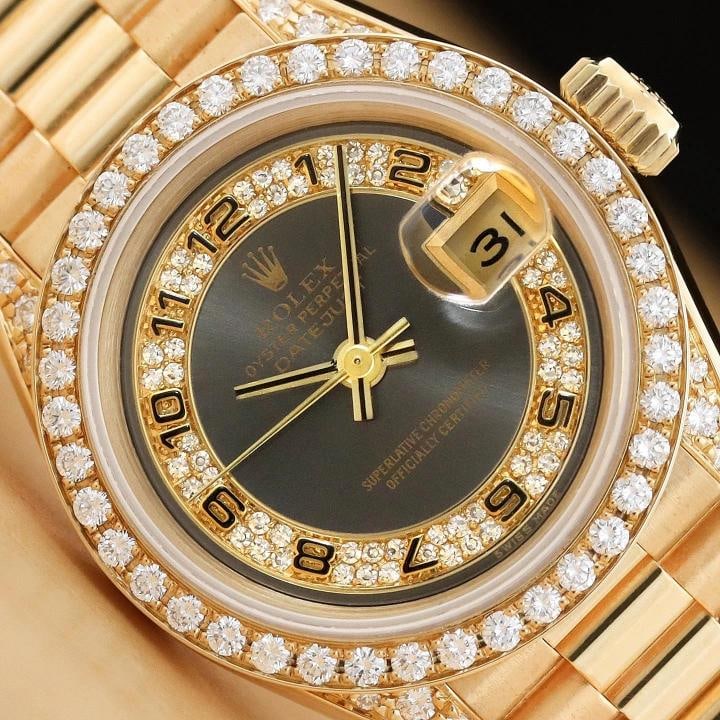 ROLEX LADIES PRESIDENT 69158 18K GOLD GRAY ARABIC FACTORY MYRIAD DIAMOND WATCH: Condition Preowned GoodBezel Color GoldMax Wrist Size 61625 inNumber of Jewels 29 JewelsIndices 12Hour DialBand Rolex 18K Yellow Gold President BraceletYear Manufactured 19801989Bezel Rolex 18K Yellow