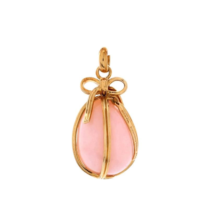 Tiffany Co Egg Charm Pendant Pendant Charms 18K Yellow Gold and Pink Opal: Measurements HeightLength 2990 mm Width 1500 mm Condition PreownedStyle 18K Yellow Gold And Pink OpalBrand Tiffany CoType Pendant CharmsColor Yellow GoldMetal 18K Yellow GoldMain Stone