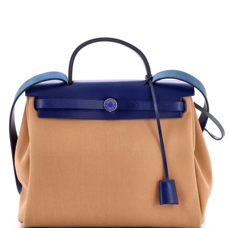 Hermes Herbag Zip Leather and Toile 31: Accessories Pochette Clochette Keys Lock With Strap Measurements Handle Drop 3 Height 10 Width 12 Depth 4 Strap Drop 185 Condition Preowned GoodBrand HermesExterior Material Leather Canvas