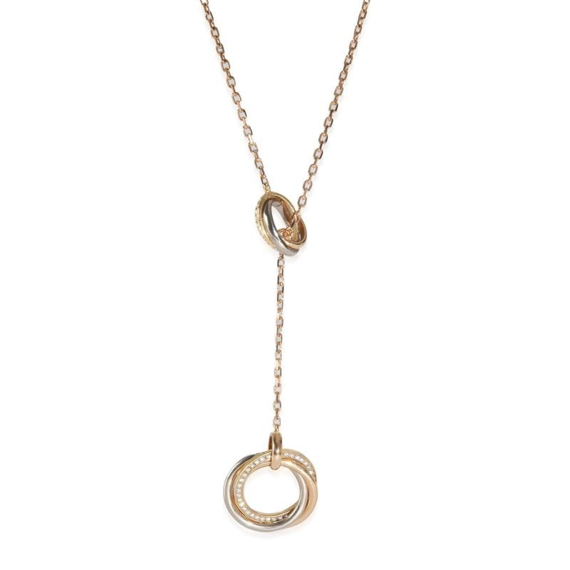 Cartier 3Tone Gold Diamond Trinity Lariat Necklace: Condition Preowned GoodPendant Shape Round BrilliantNecklace Length 20 inCountry of Origin FranceClaspBuckle Type Lobster ClawWith Original BoxPackaging YesWith Papers YesSide Stone Type DiamondSide