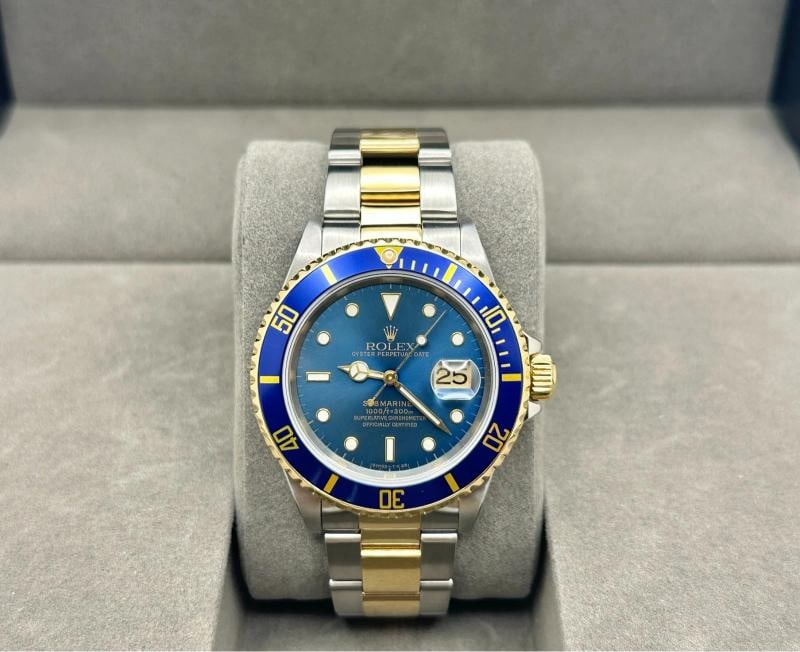 Rolex Submariner Date Blue 16613 40mm Tropical Faded Blue Dial 18k Gold Steel: Style Number 16613 Serial U440 Year 1997 Model Rolex Submariner Date Blue Case Material Stainless Steel Band 18k Yellow Gold Stainless Steel Bezel Blue Dial STUNNING Faded Blue Tropical Dial Dial is f