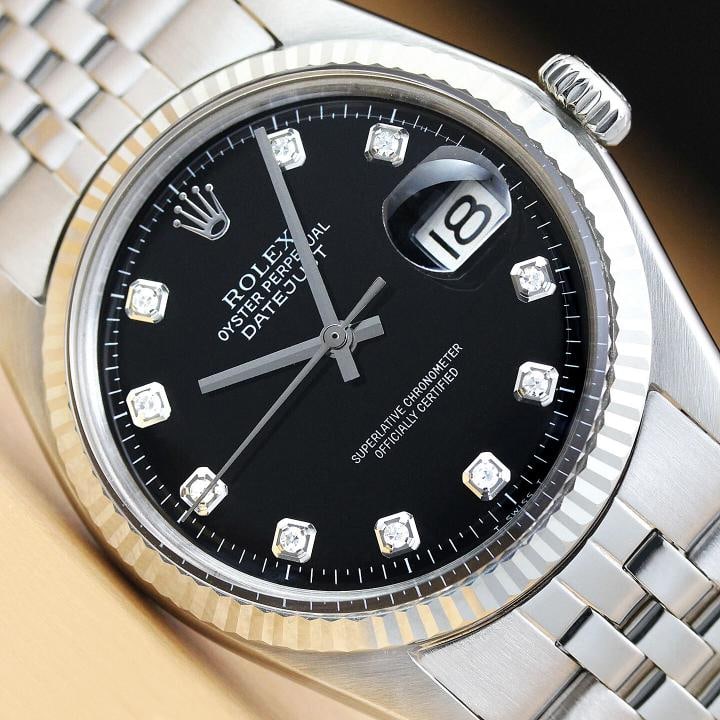 ROLEX MENS DATEJUST 1601 18K WHITE GOLD STAINLESS STEEL BLACK DIAMOND WATCH: Condition Preowned GoodBezel Color SilverMax Wrist Size 72675 inNumber of Jewels 26 JewelsIndices Diamond Markers 12Hour Dial Multiple HandsBezel Rolex 18K White Gold Fluted BezelBandStrap BraceletLin