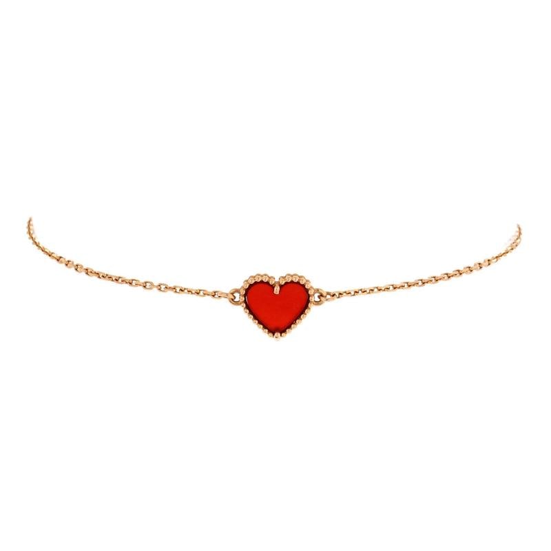 Van Cleef Arpels Sweet Alhambra Heart Bracelet 18K Rose Gold with Carnelian: Condition Preowned GoodBrand Van Cleef ArpelsMain Stone CarnelianMetal 18K Rose GoldMetal Purity 18KStyle BraceletType BraceletColor Rose GoldMaterial 18K Rose Gold Carnelian 