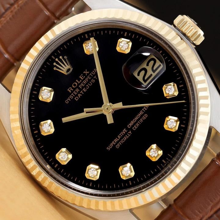 ROLEX DATEJUST 1601 14K GOLD STEEL BLACK DIAMOND WATCH w BROWN LEATHER BRACELET: Condition Preowned GoodBezel Color GoldMax Wrist Size 72675 inNumber of Jewels 26 JewelsIndices Diamond Markers 12Hour DialBezel Rolex 14K Yellow Gold Fluted BezelBandStrap BraceletLink BandCase