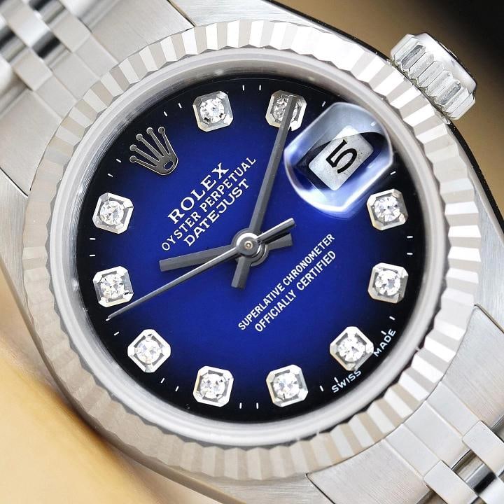 ROLEX LADIES DATEJUST 69174 BLUE VIGNETTE DIAMOND 18K WHITE GOLD STEEL WATCH: Condition Preowned GoodBezel Color SilverMax Wrist Size 626675 inNumber of Jewels 29 JewelsIndices Diamond Markers 12Hour DialBand Custom SS Jubilee BraceletBezel Rolex 18K White Gold Fluted