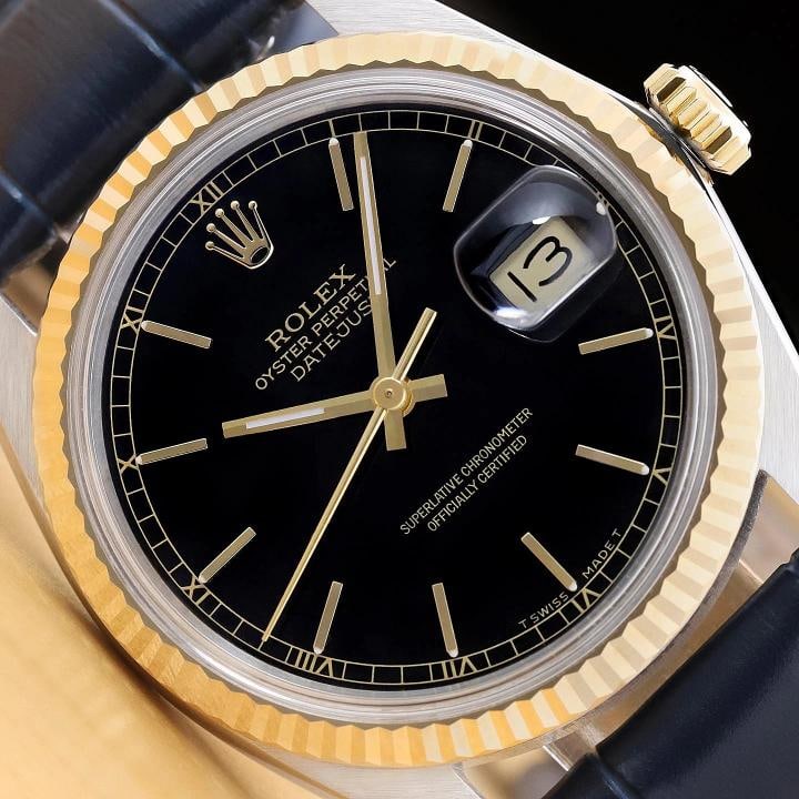 ROLEX MENS DATEJUST 16013 BLACK 18K GOLD STAINLESS STEEL BLUE LEATHER BAND WATCH: Condition Preowned GoodBrand RolexDepartment MensDial Rolex Stick Dial RefBezel Rolex 18K Yellow Gold Fluted BezelFeatures 12Hour Dial Acrylic Crystal Chronometer Screwdown Crown Seconds Hand