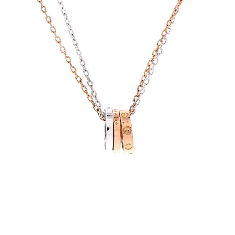 Cartier Love 3 Ring Pendant Necklace 18K Rose Gold and 18K White Gold with 6: Condition Preowned GoodBrand CartierMain Stone DiamondMetal 18K Rose GoldMetal Purity 18KStyle PendantType NecklaceColor White GoldMaterial 18K Rose Gold 18K White Gold Diamond Condition Great Minor w