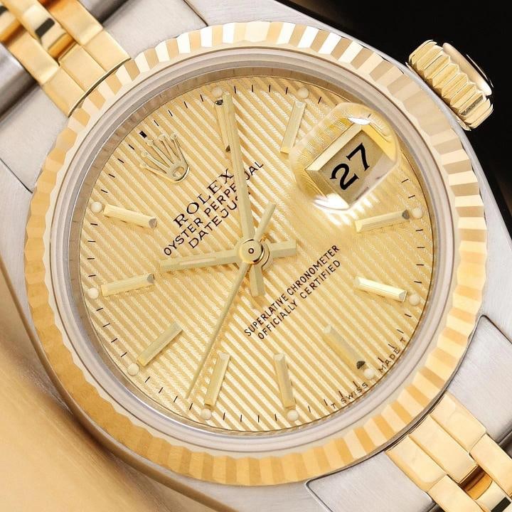 ROLEX LADIES DATEJUST 69173 18K GOLD STEEL TWO TONE CHAMPAGNE TAPESTRY WATCH: Condition Preowned GoodBezel Color GoldMax Wrist Size 626675 inNumber of Jewels 29 JewelsIndices Stick Indexes 12Hour DialBand Rolex Two Tone Jubilee BraceletBezel Rolex 18K Yellow Gold Fluted