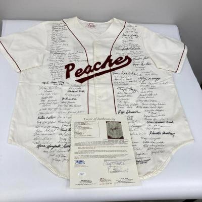 The Finest Ã¢â‚¬Å“A League Of Their OwnÃ¢â‚: Rockford Peaches jersey with the Columbia Pictures "Official Cast and Crew Merchandise" tag for A League of Their Own - signed by an incredible 126 members of the league. Signatures include Dottie