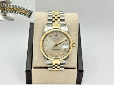Rolex Datejust 16013 36mm Factory Silver Diamond Dial 18K Yellow Gold Steel: Style Number: 16013 Serial: 9340*** Year: 1986 Model: Rolex Datejust Case Material: Stainless Steel Band: 18K Yellow Gold & Stainless Steel Bezel: 18K Yellow Gold Dial: Factory Silver Diamond Dial Cry