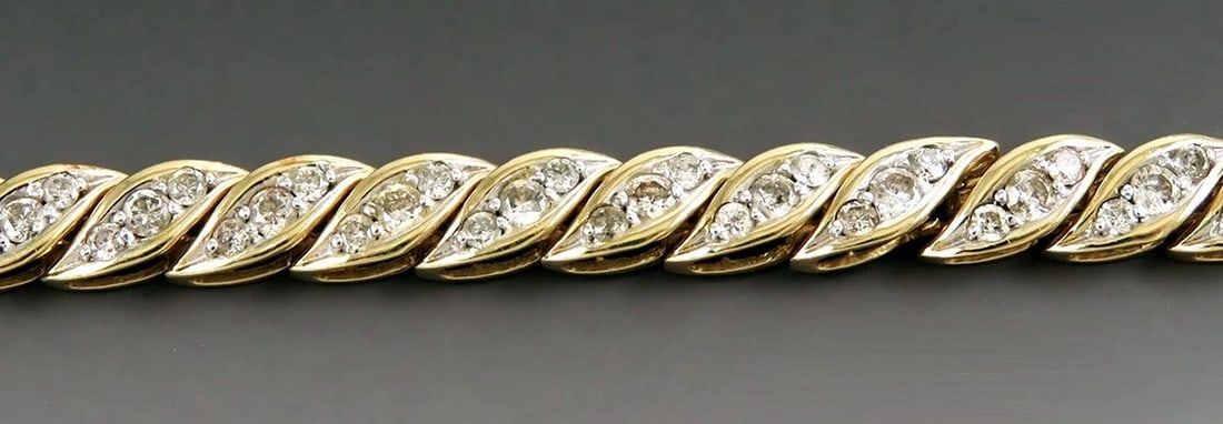 Stunning 14k Yellow Gold ~2.7ct Diamond Bracelet: The bracelet will fit a wrist of about 7 1/4 inches in circumference, and the band is about 5.7 millimeters wide. The bracelet weighs 13.7 grams..Each of the 30 links is set with three diamonds