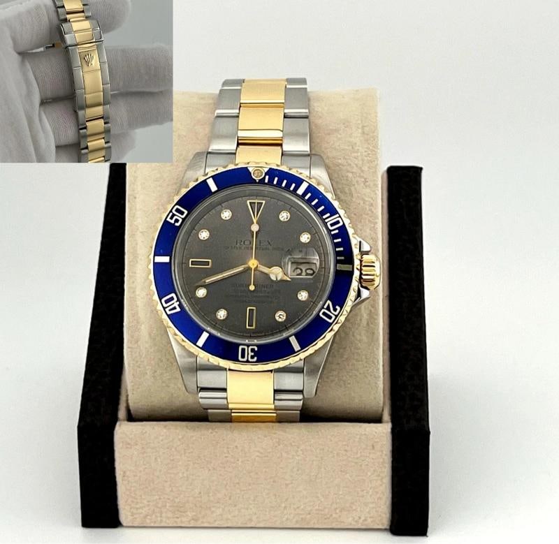 Rolex Submariner Date Blue 16613 40mm Tropical Serti Diamond Dial 18k Gold Steel: Style Number: 16613 Serial: K71**** Year: 2001 Model: Rolex Submariner Date Case Material: Stainless Steel Band: 18k Yellow Gold & Stainless Steel Bezel: Blue Dial: