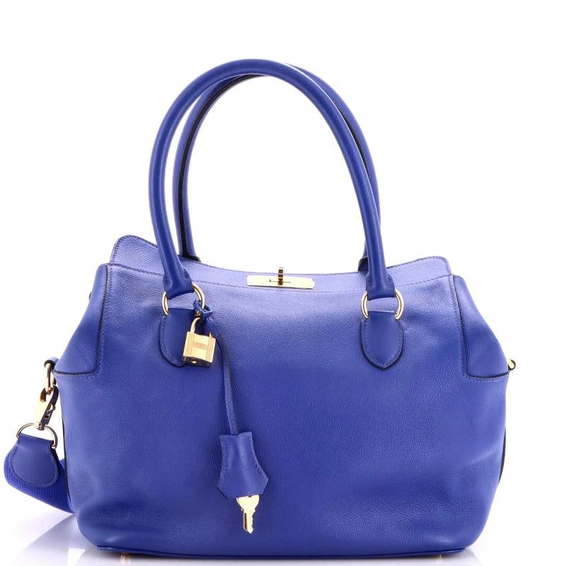 Hermes Toolbox Bag Evercolor 26: Condition: Pre-owned - Good,Brand: Hermes,Exterior Material: Leather,Style: Top Handle,Exterior Color: Blue,Department: Women,Size: 26,Accessories: Lock, Clochette, Keys, With Strap Condition: Good.
