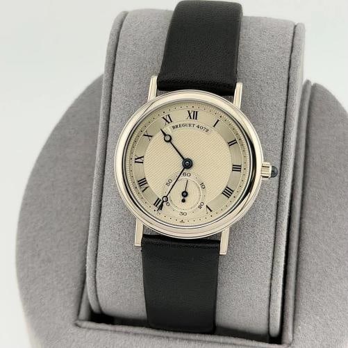 Breguet Classique 3210 30.5mm Silver Roman Dial Manual Winding 18k White Gold: Condition: Pre-owned - Excellent,Bezel Color: Silver,Movement: Mechanical (Manual),Seller Warranty: Yes,Indices: Roman Numerals,Band/Strap: Two-Piece Strap,Reference Number: 3210,Brand: Breguet,Case