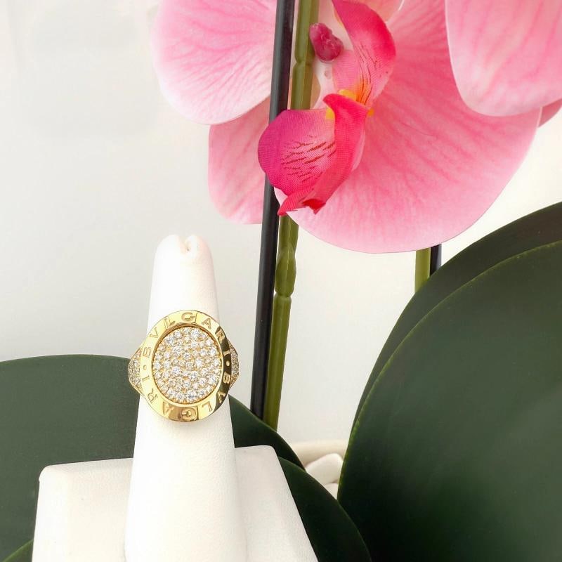 BVLGARI Bvlgari Pave Diamond Circle Signature Ring in 18k Yellow Gold: Condition: Pre-owned - Good,Country of Origin: Italy,Number of Diamonds: 69,Main Stone Creation: Natural,Shape: Round,Signed: Yes,Main Stone Color: White/Colorless,Metal: Yellow Gold,Main Stone: