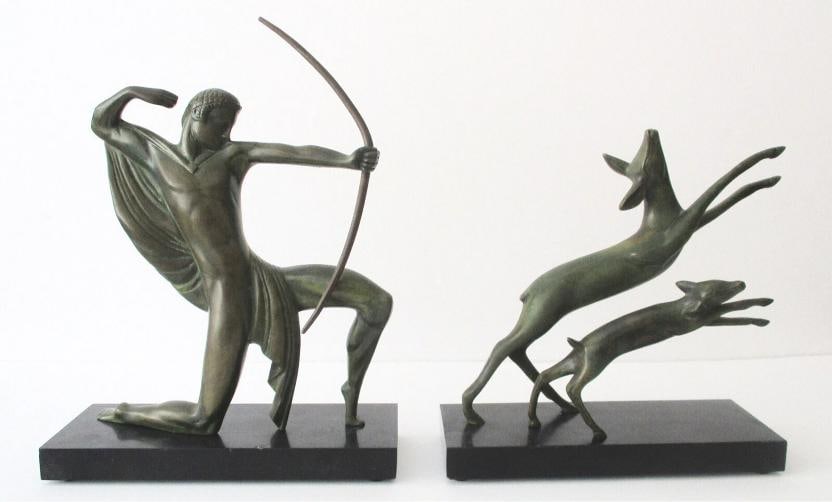 LOT OF 2~Michel Decoux Vintage Bronze Art Sculptures~(Signed): Each black marble plinth measures 7 3/4 inches long 3 inches wide 7/8 inch high The Hunter is 9 inches high, including the plinth, with a weight of 6.2 pounds The Two Deer is 8 inches high with a
