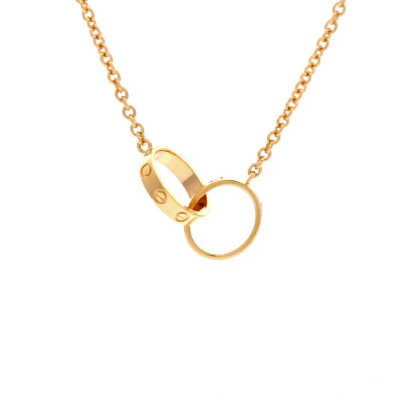 Cartier Love Interlocking Necklace 18K Yellow Gold: Condition: Pre-owned - Good,Brand: Cartier,Main Stone: Unknown,Metal: 18K Yellow Gold,Metal Purity: 18K,Style: Necklace,Type: Necklace,Color: Yellow Gold,Material: 18K Yellow Gold 