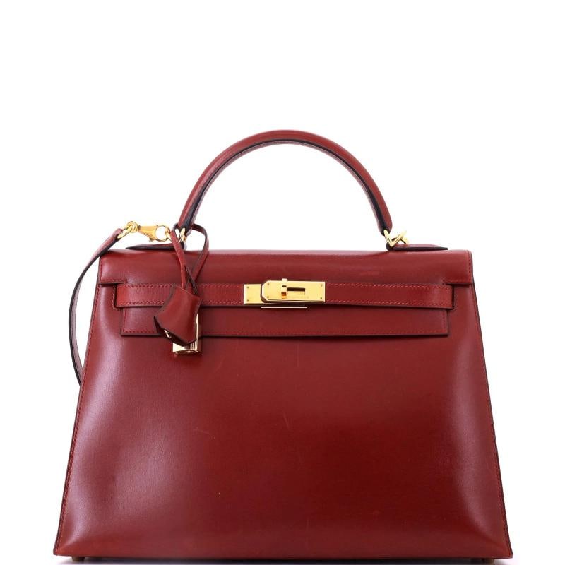 Hermes Kelly Handbag Red Box Calf with Gold Hardware 32: Accessories: Keys, Lock, Clochette, With Strap Measurements: Handle Drop 4", Height 10", Width 13", Depth 5", Strap Drop 17". Condition: Pre-owned - Good,Brand: Hermes,Exterior Material: