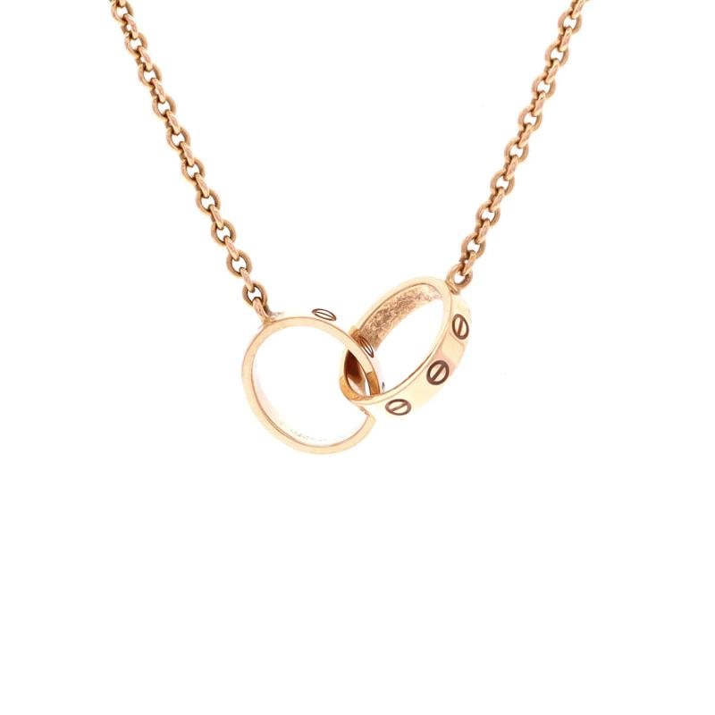 Cartier Love Interlocking Necklace 18K Rose Gold: Measurements: Length: 17.25 ", Pendant Length: 0.75 ", Pendant Width: 2.55 mm . Condition: Pre-owned - Good,Brand: Cartier,Main Stone: Unknown,Metal: 18K Rose Gold,Metal Purity: 18K,Style: Necklace,Ty