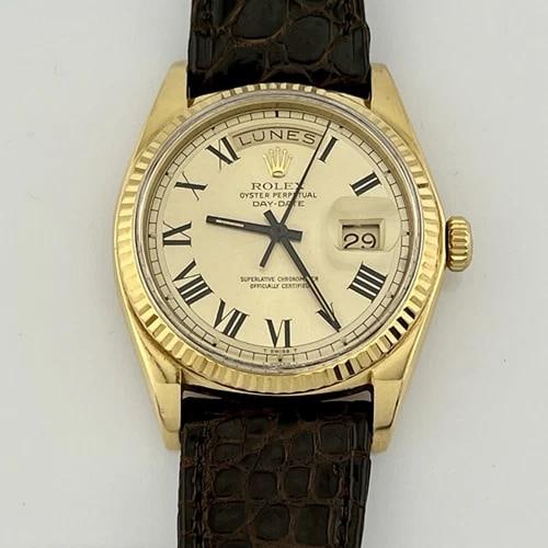 Rolex Day Date President 1803 Buckley Dial 18K Yellow Gold Leather Strap: Style Number: 1803 Serial: 3841*** Year: 1974 Model: Rolex Day Date Case Material: 18K Yellow Gold Band: Custom Leather Band Bezel: 18K Yellow Gold Dial: Champagne Buckley