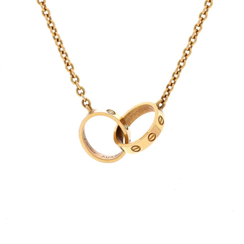 Cartier Love Interlocking Necklace 18K Yellow Gold: Condition: Pre-owned - Good,Brand: Cartier,Main Stone: Unknown,Metal: 18K Yellow Gold,Metal Purity: 18K,Style: Necklace,Type: Necklace,Color: Yellow Gold,Material: 18K Yellow Gold 