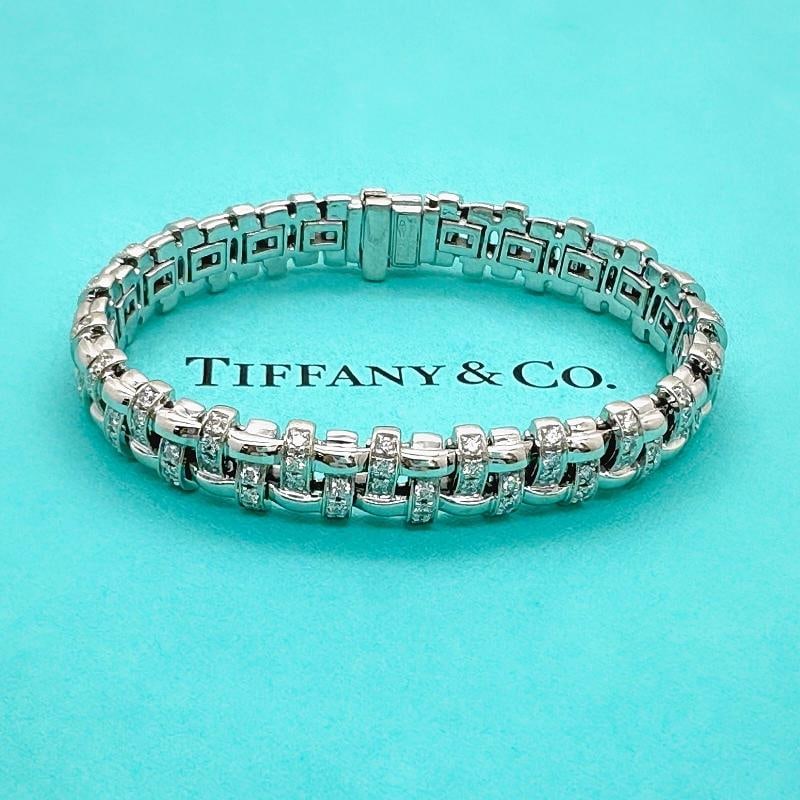 Tiffany & Co Vannerie Basket Weave Diamond Bracelet in 18kt White Gold: Condition: Pre-owned - Good,Closure: Hinged,Signed: Yes,Color: White,Main Stone Color: White,Metal: White Gold,Item Length: 7 in,Main Stone: Diamond,Brand: Tiffany & Co.,Main Stone Treatment: Not